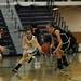 Saline senior Melissa Needham jumps on a loose ball in the game against Woodhaven on Tuesday, March 5. Daniel Brenner I AnnArbor.com